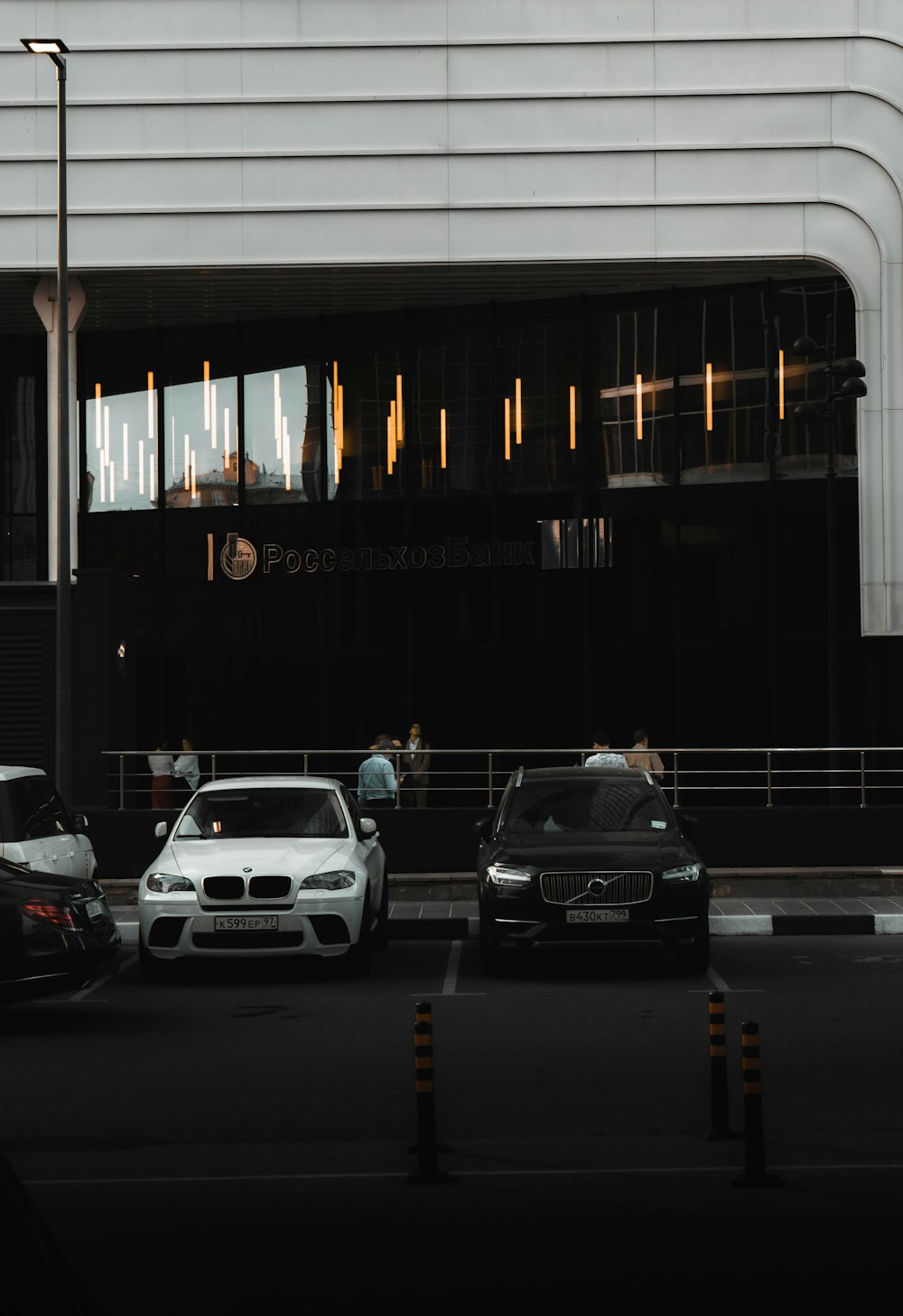 cars parked in front of building during night time