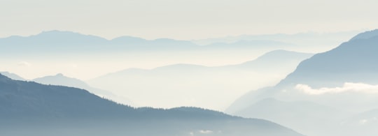 green mountains under white sky during daytime in British Columbia Canada