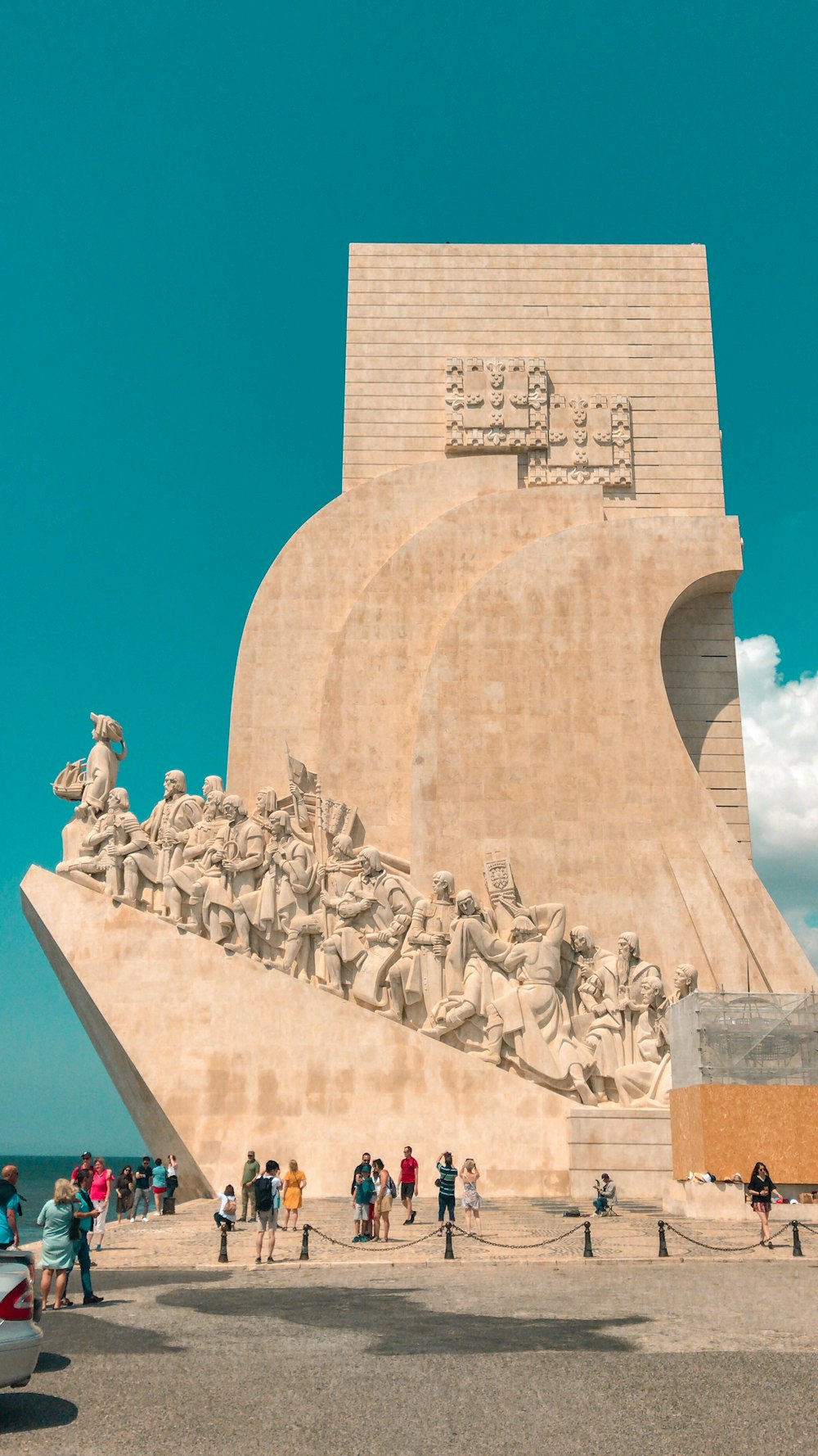 gray concrete statues under blue sky during daytime