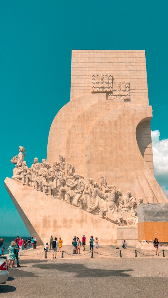 gray concrete statues under blue sky during daytime in Padrão dos Descobrimentos Portugal