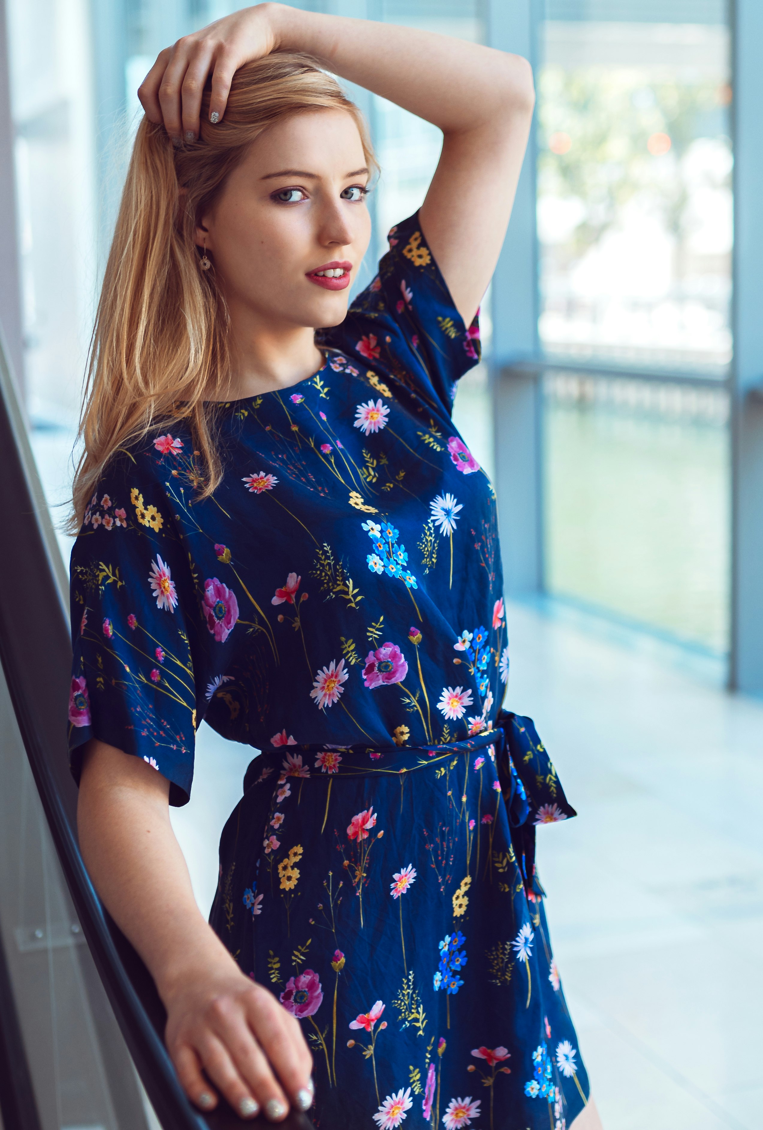 woman in blue and red floral dress