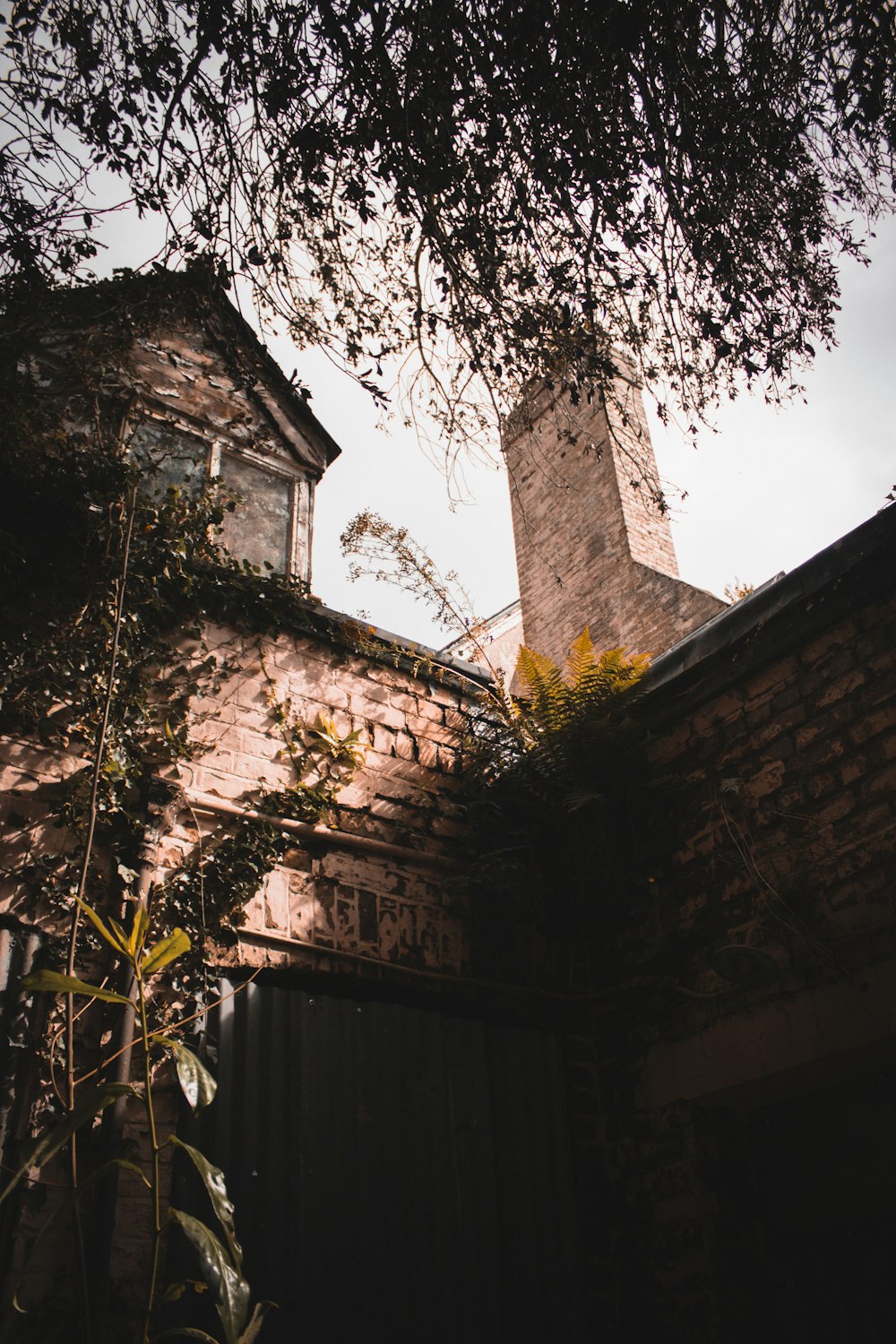 brown brick building near trees