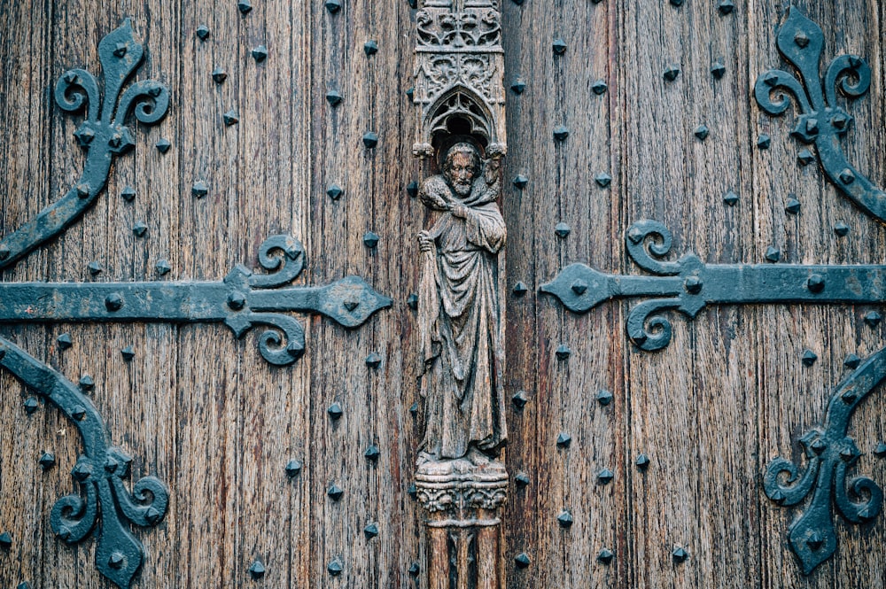 brown wooden door with brass door lever