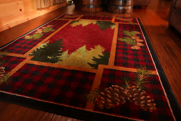 A rustic cabin floor adorned with a thick, warm-toned carpet from Velora's collection.