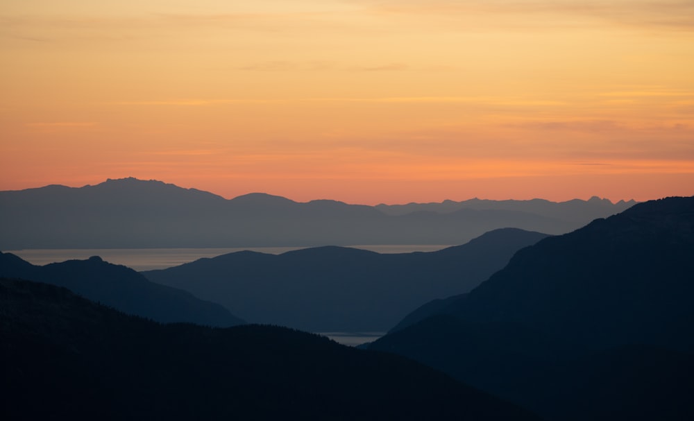 silhouette of mountains during sunset