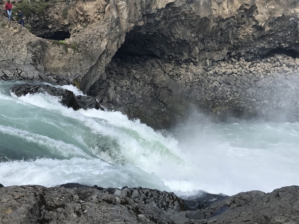 water falls on rocky mountain