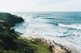 A scenic coastal view showcasing waves crashing on rocks.