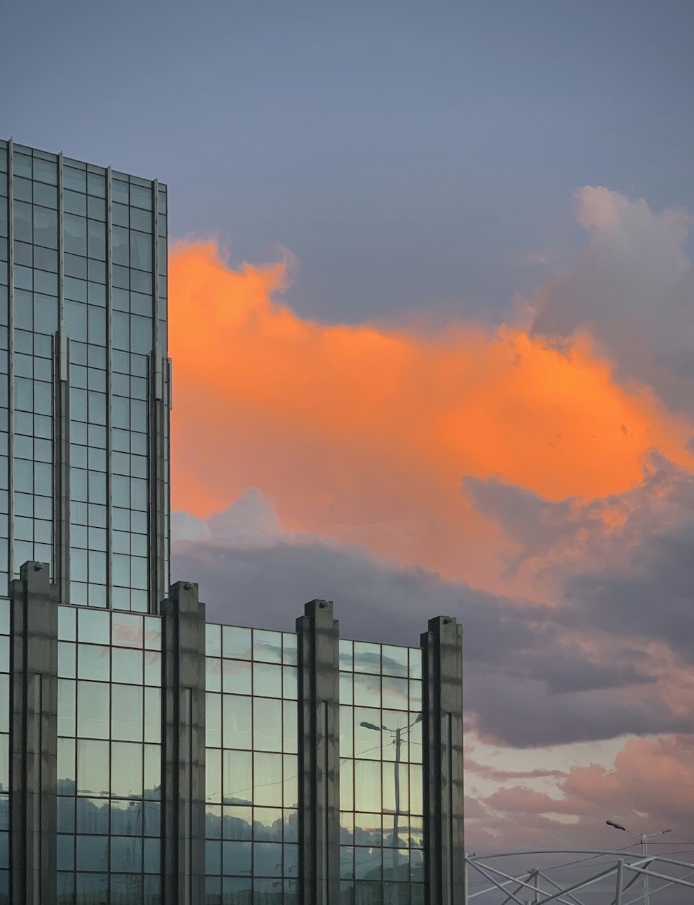 gray concrete building under orange clouds