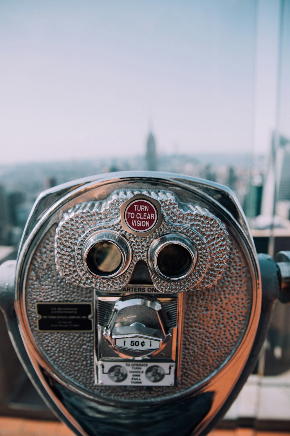 gray and black coin operated binoculars