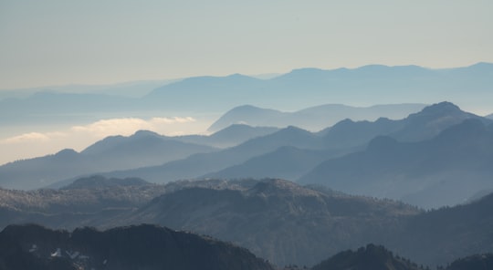 mountains under white clouds during daytime in Mount Tantalus Canada