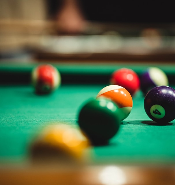 billiard balls on billiard table