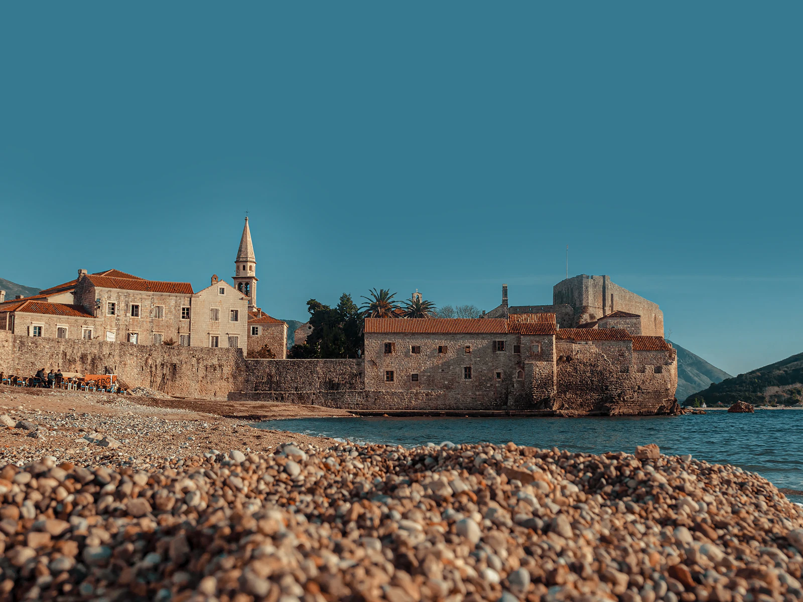 The walled old town of Budva on its rock, with the sea on both sides