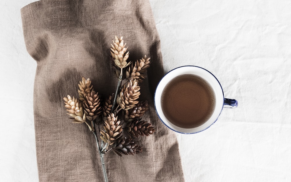 white ceramic mug with coffee