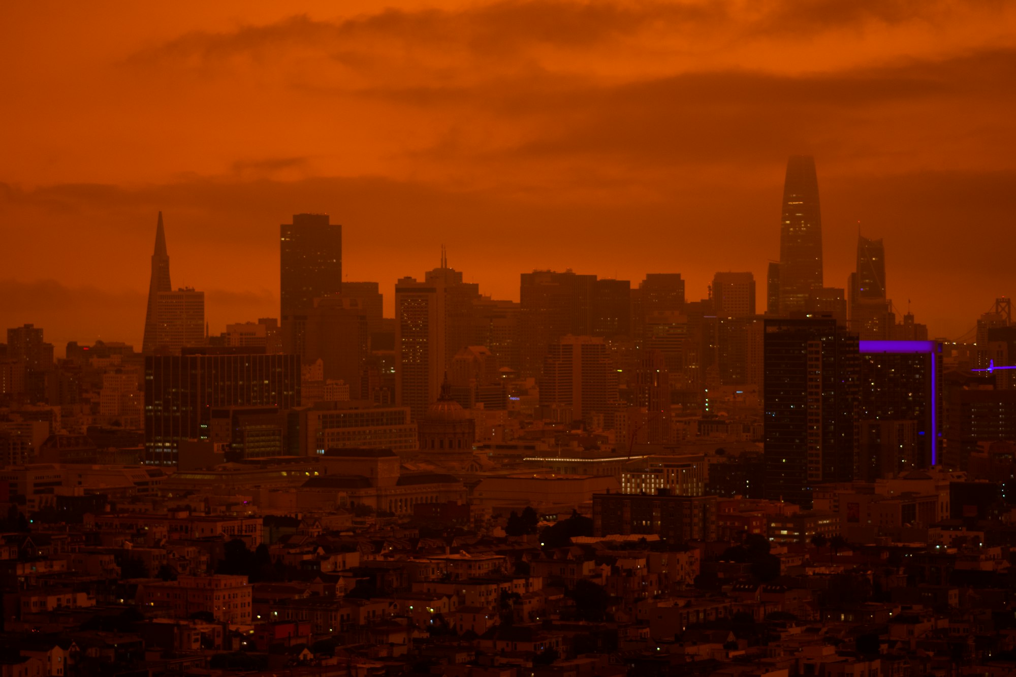 a red sky over the city skyline of San Francisco