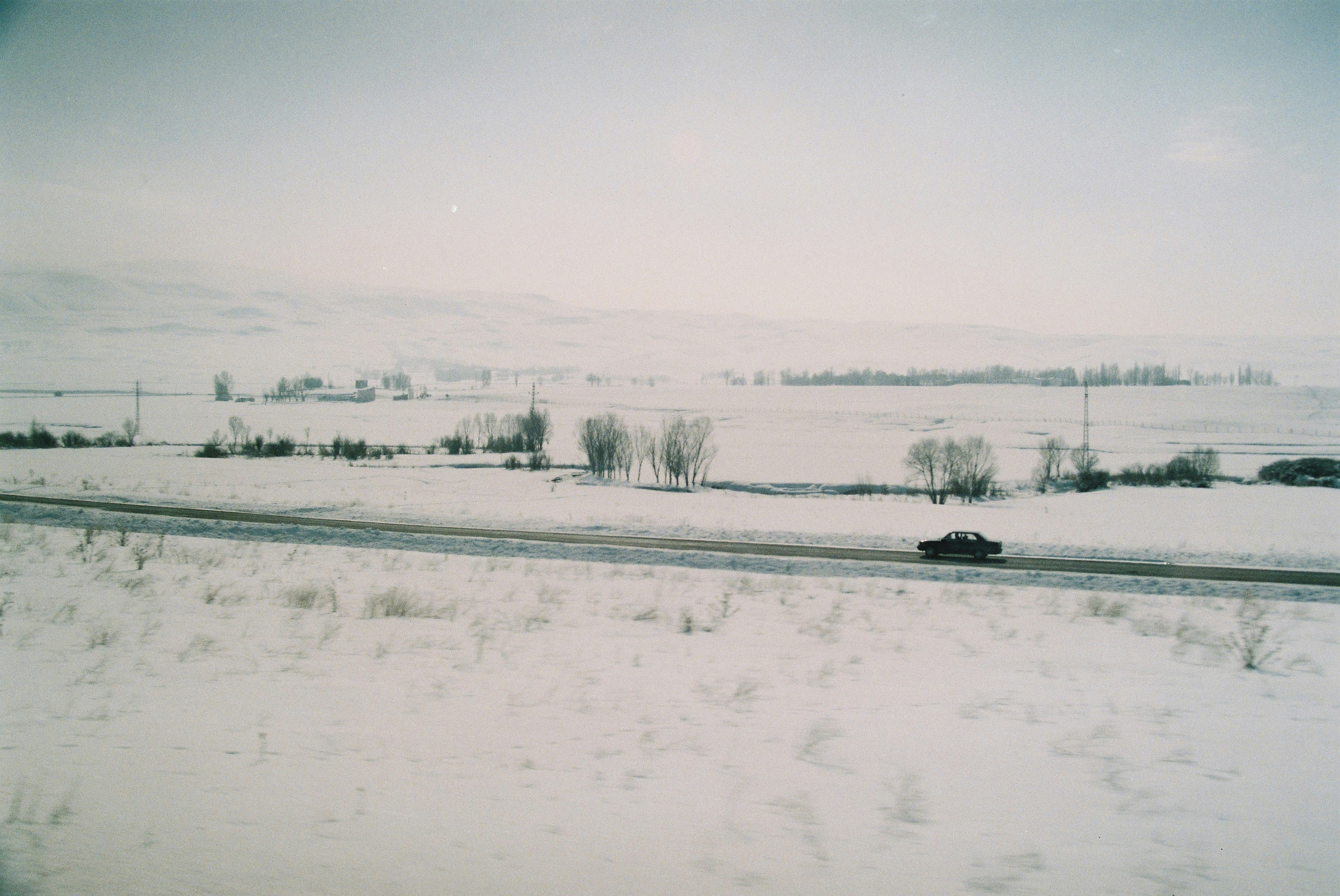 snow covered field during daytime