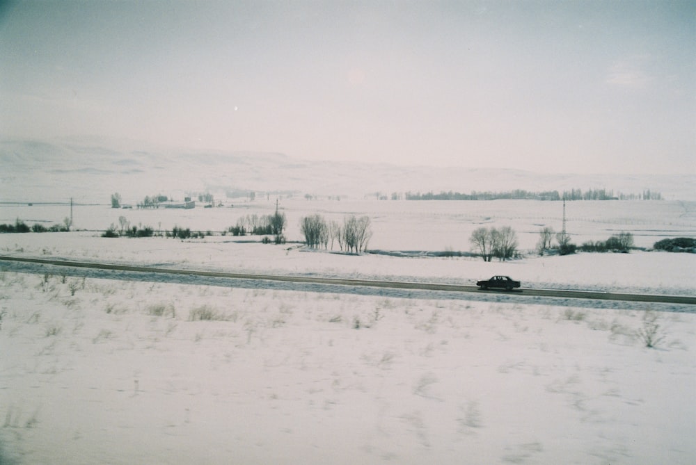 snow covered field during daytime