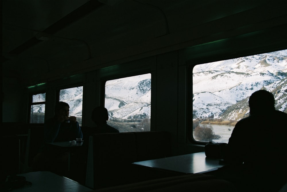 people sitting inside vehicle during daytime