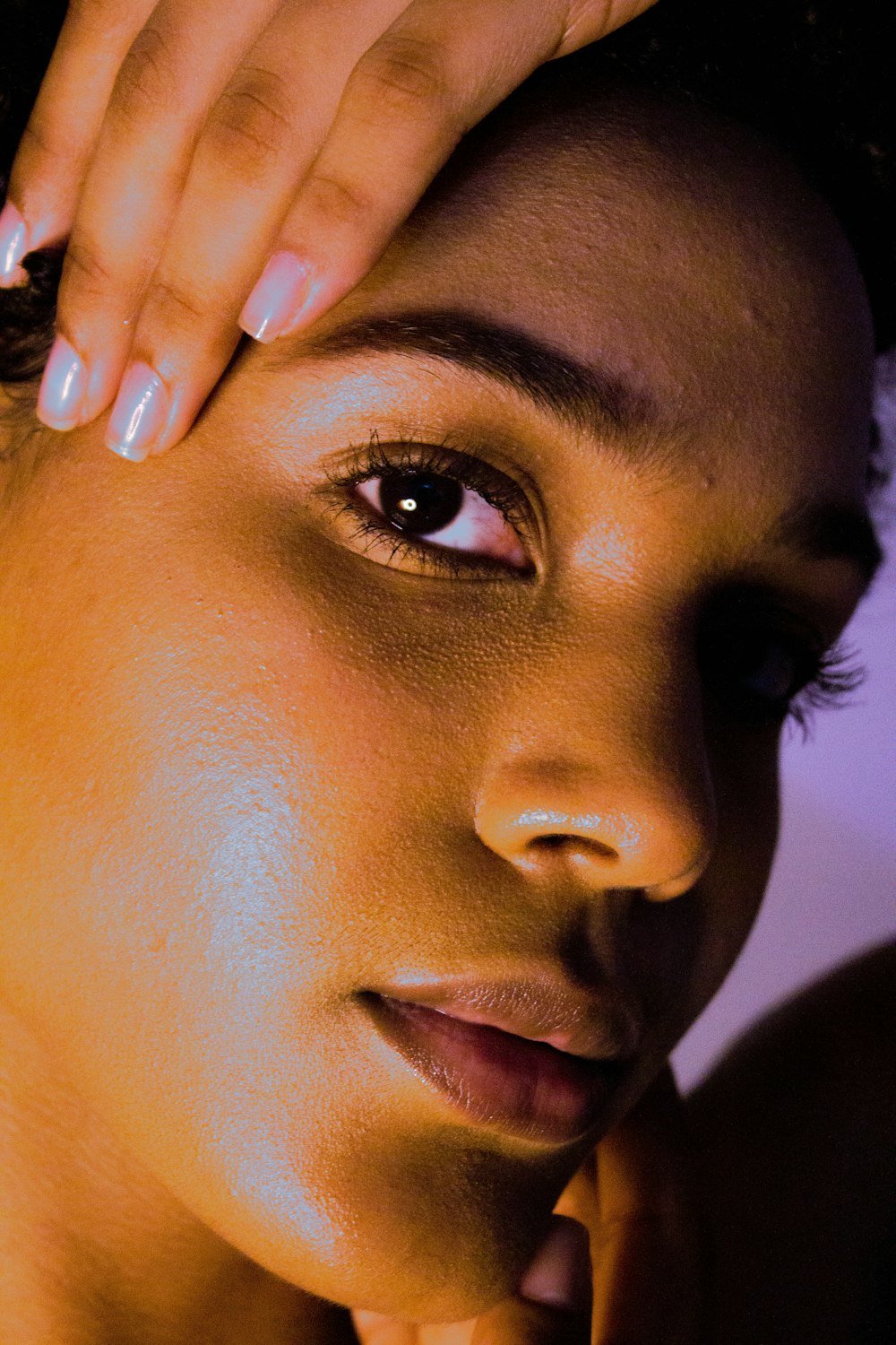 woman with black hair and wearing silver ring