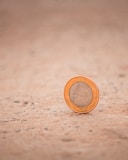 silver and gold round coin