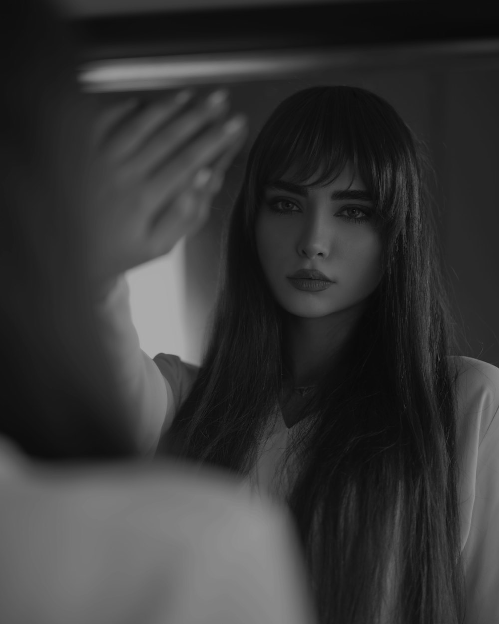 grayscale photo of woman in white shirt