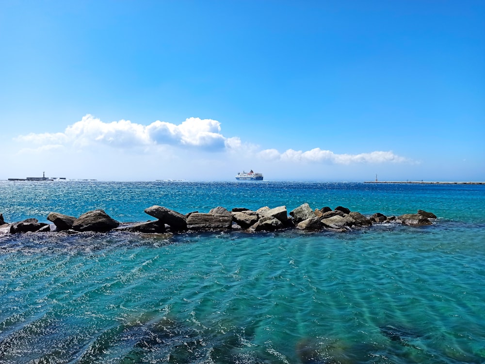 rocky shore under blue sky during daytime