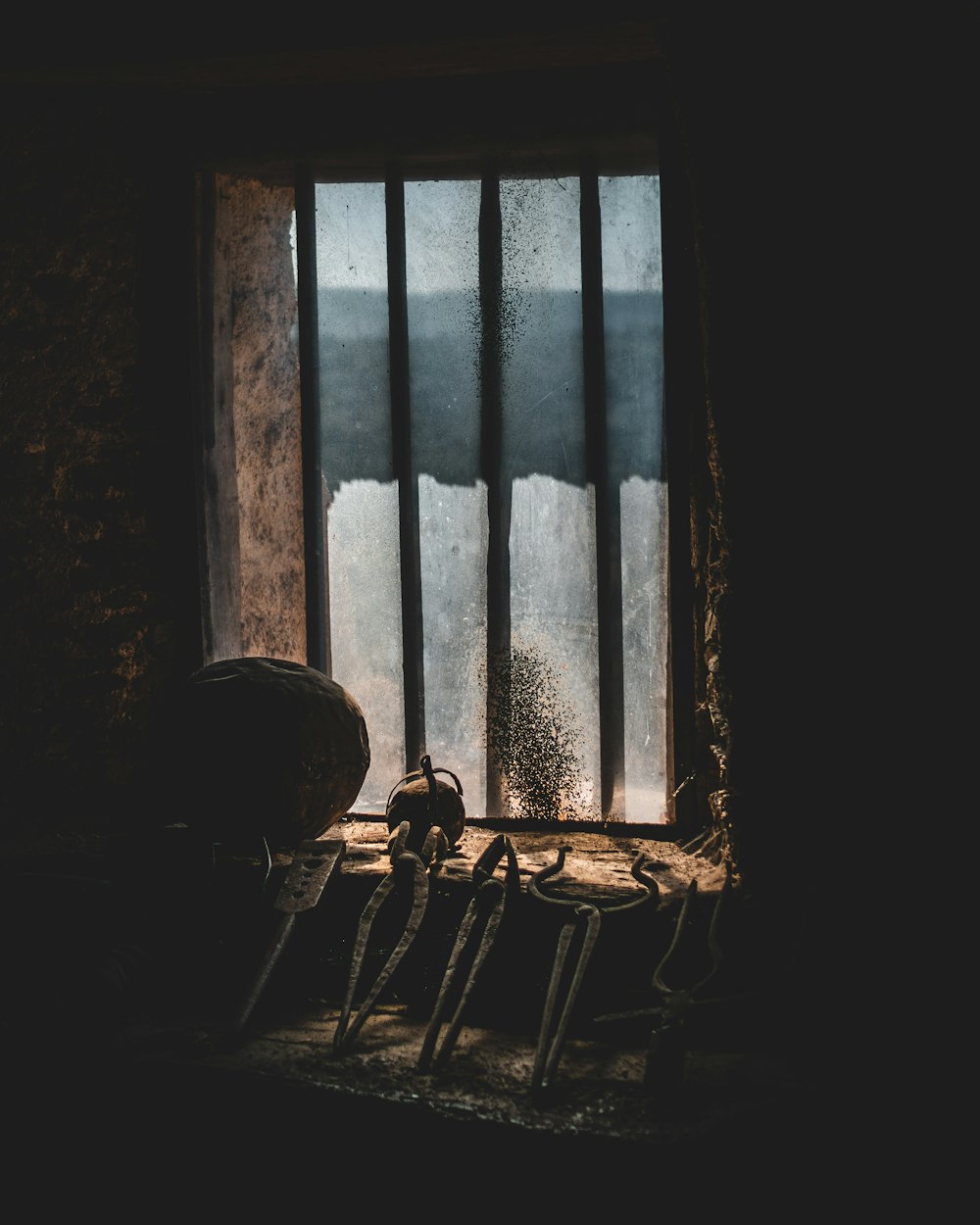 silhouette of person sitting on chair near window