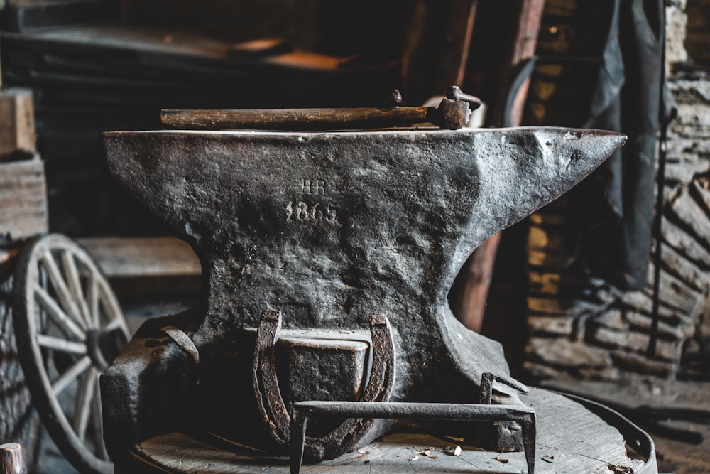 black metal tool on brown wooden table