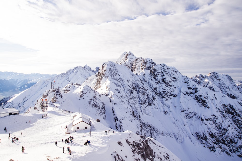 people on snow covered mountain during daytime