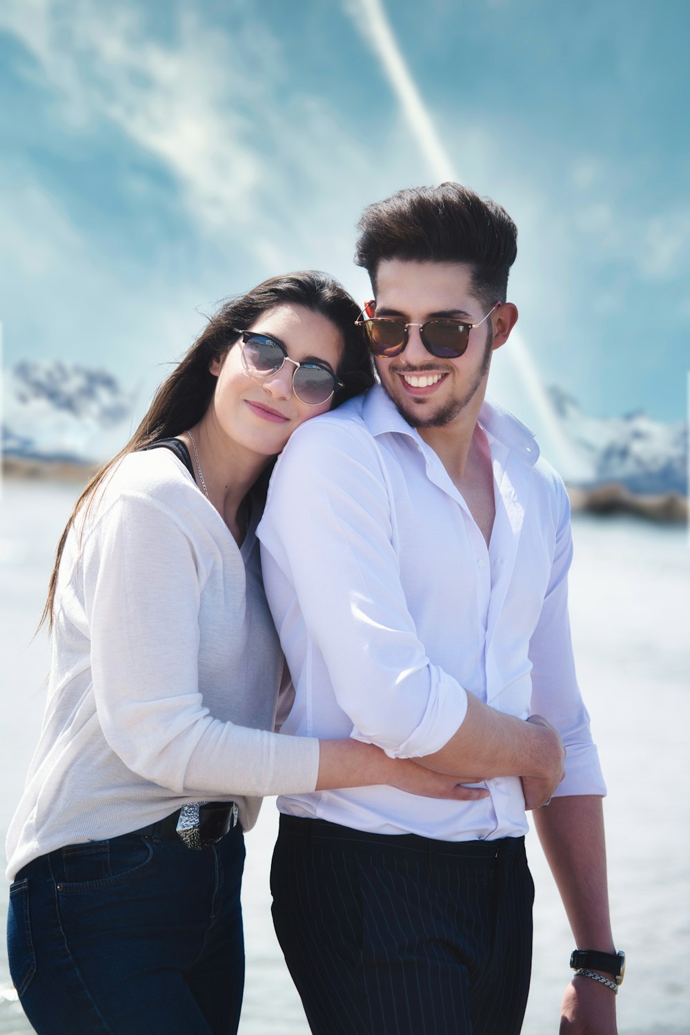 woman in white dress shirt wearing black sunglasses