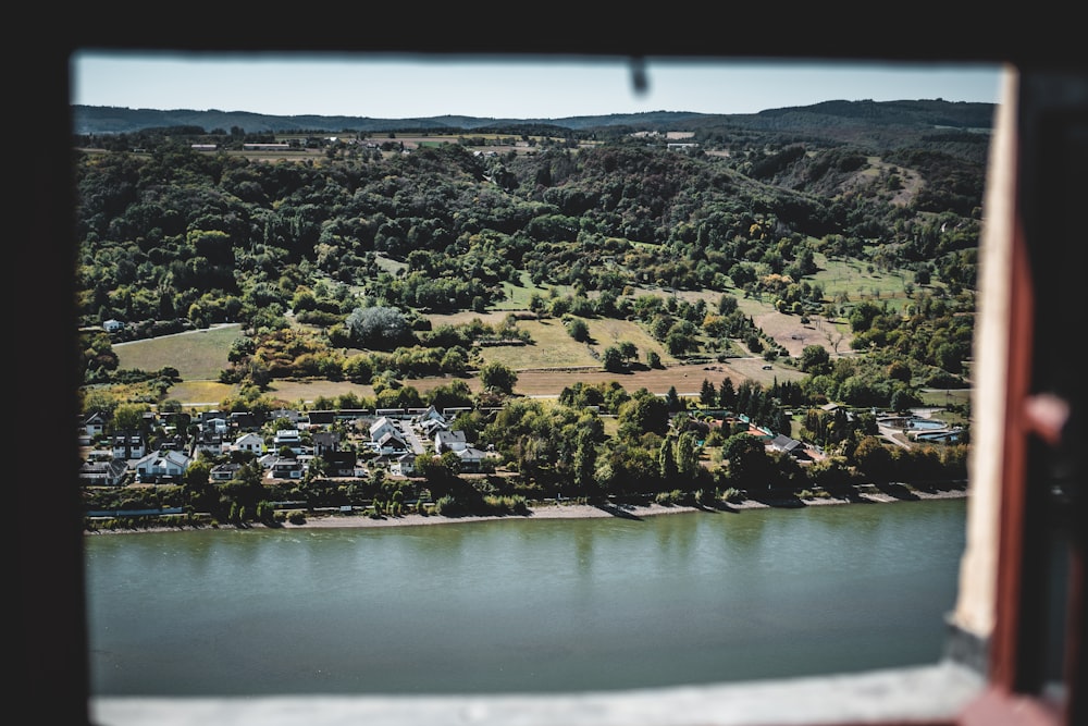 aerial view of city near body of water during daytime