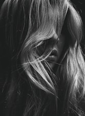 grayscale photo of womans face