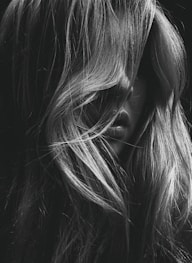 grayscale photo of womans face