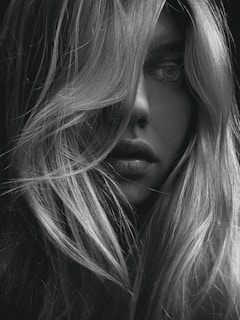 grayscale photo of womans face