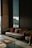 brown and white couch beside window
