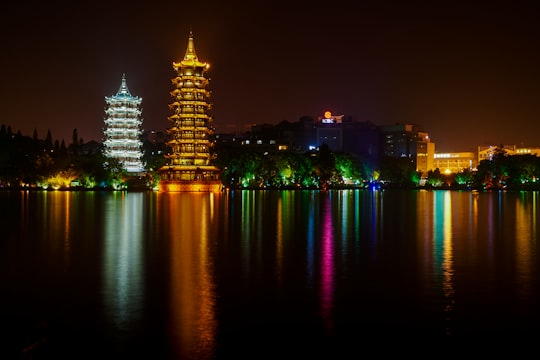 city skyline during night time in Riyue Shuangta Cultural Park China