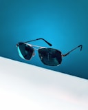 black framed aviator style sunglasses