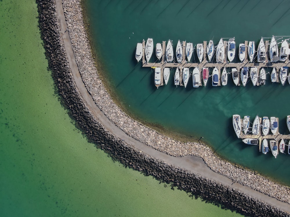 a group of boats are docked at a pier