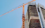 orange crane on top of building