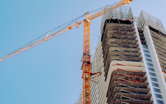 orange crane on top of building