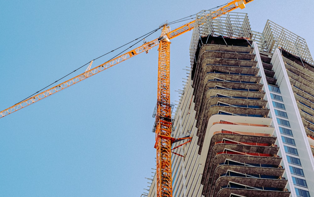 orange crane on top of building