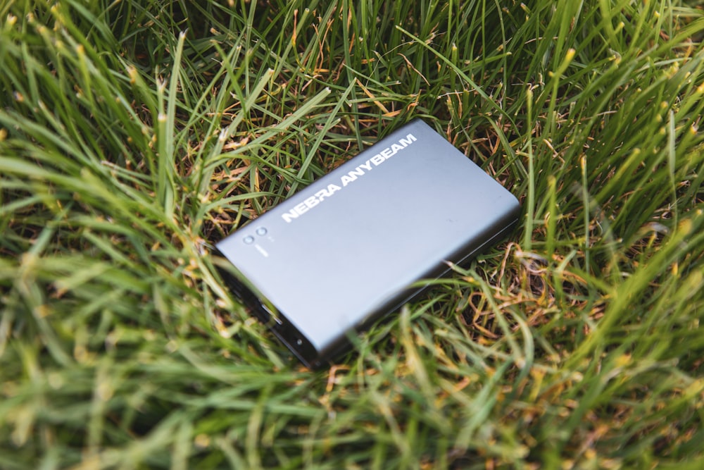 black sony xperia on green grass