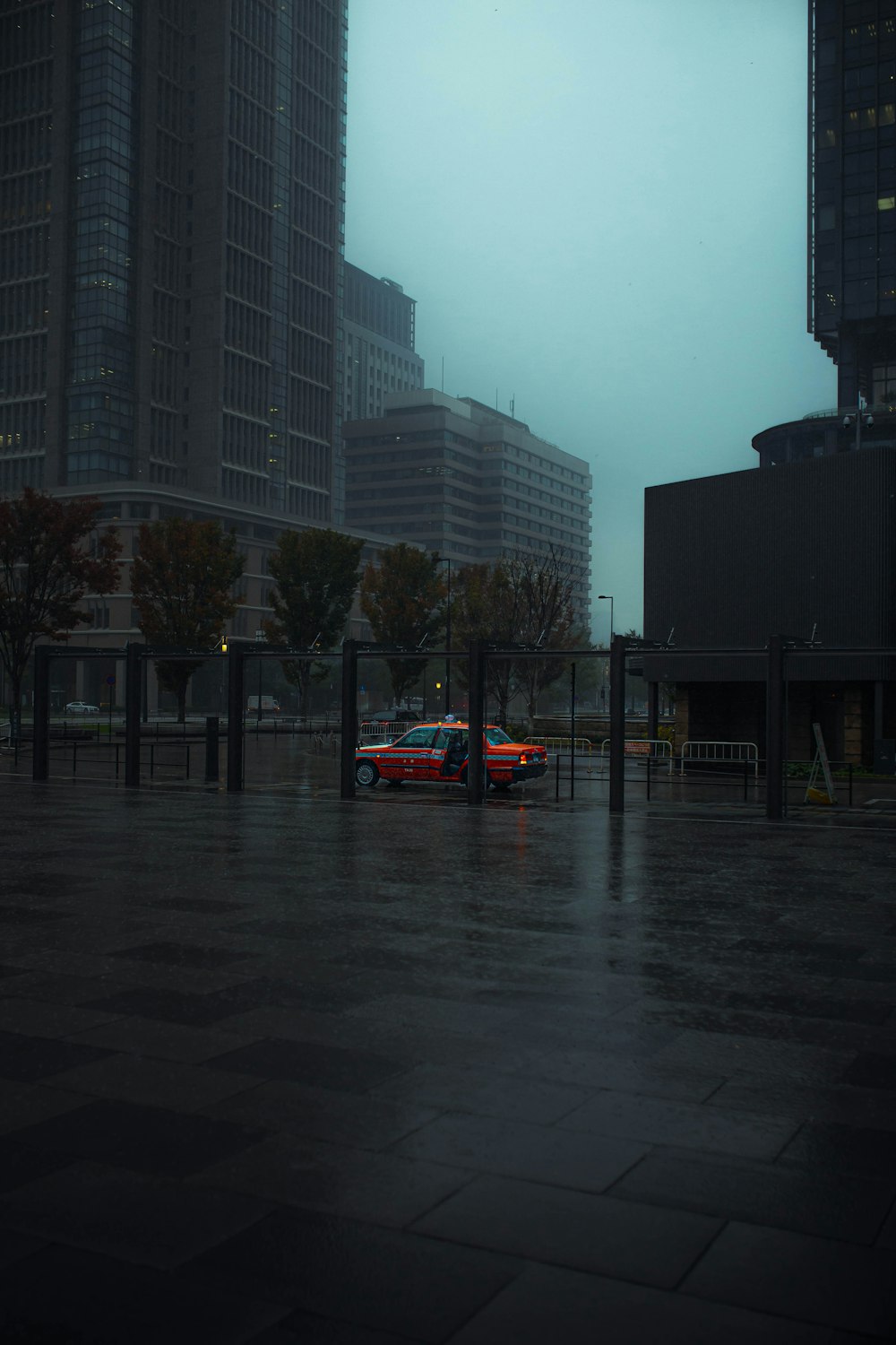 red car on road during daytime