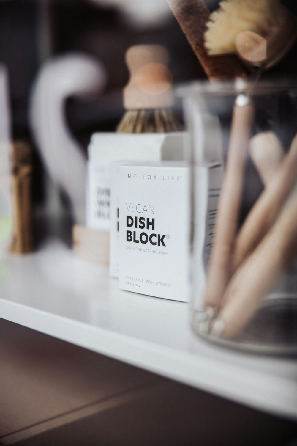 a close up of a bottle of dish block on a counter
