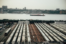 brown and white concrete building near body of water during daytime