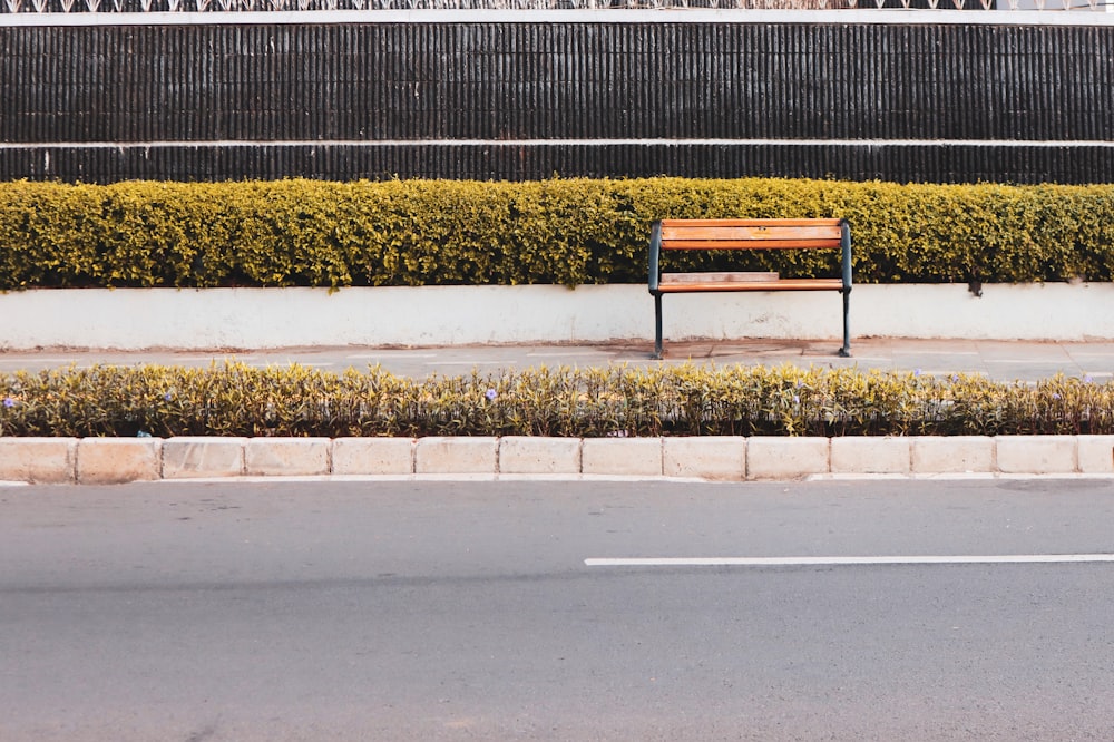 brown wooden bench on green grass field during daytime