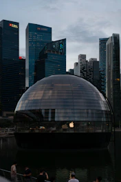 Logos of Simdarby Singapore, Singtel, and World Resort displayed on a sleek, modern office wall.