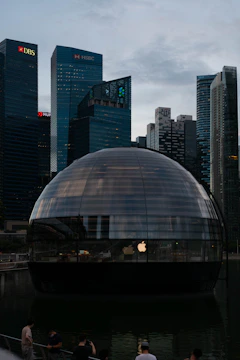 Logos of Simdarby Singapore, Singtel, and World Resort displayed on a sleek, modern office wall.