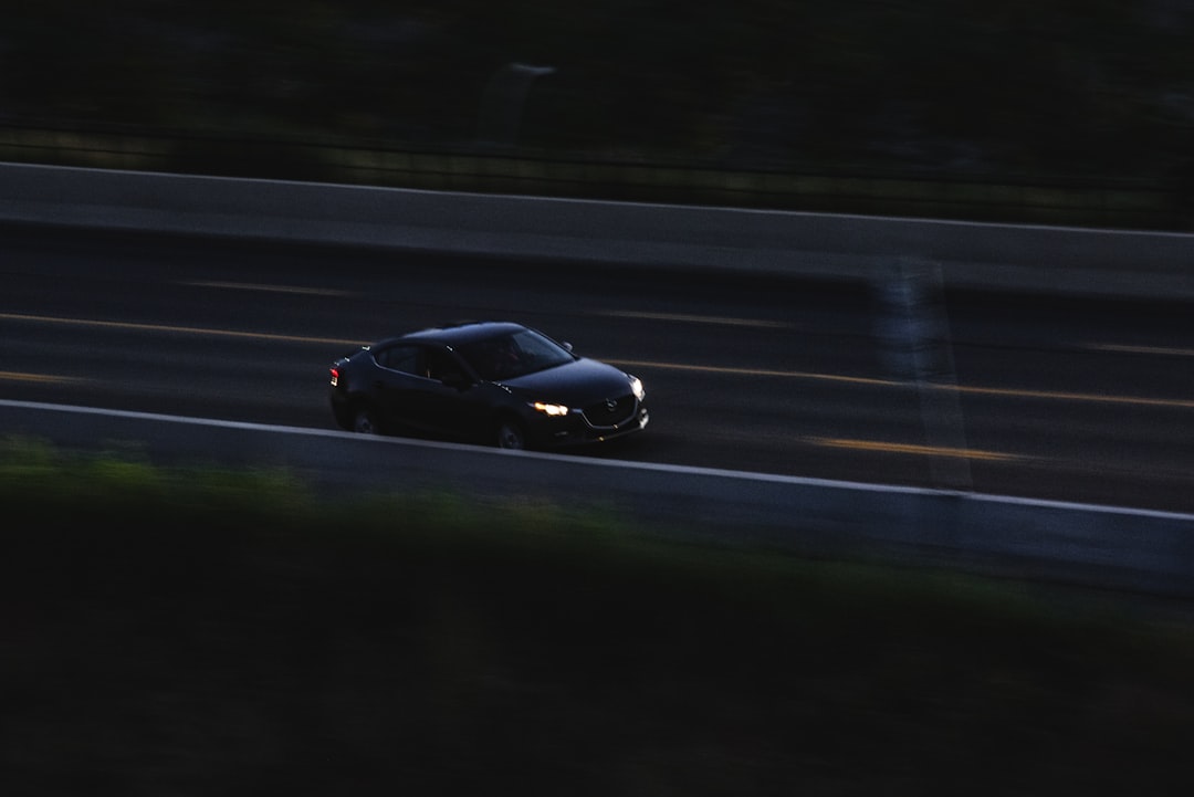 black lamborghini aventador on road