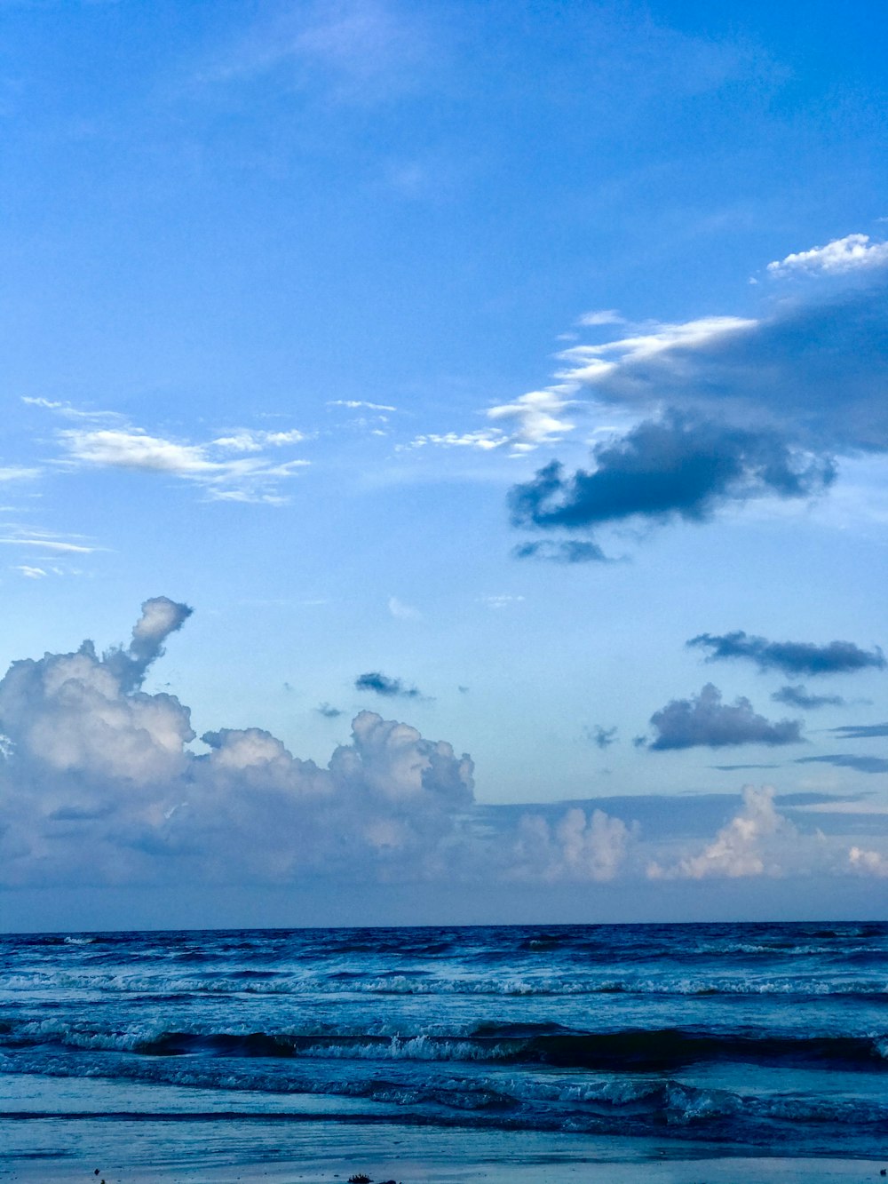 blue sky and white clouds over sea