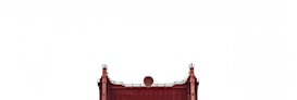 The upper section of a red iron structure, resembling a bridge or industrial edifice, is visible against a plain white background. The structure features vertical and horizontal beams with small finial-like ornaments on top.